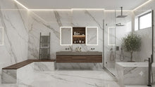 Load image into Gallery viewer, A luxury modern bathroom featuring white and gray marble walls and floors, a floating double-sink vanity with dark wood cabinets, a walk-in shower with glass enclosure, a freestanding bathtub, and built-in LED lighting.